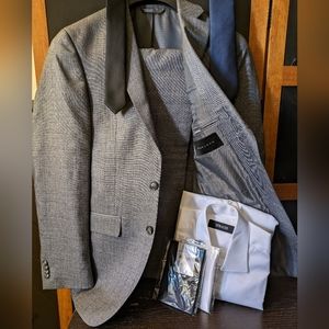 "Great deal"   Suit jacket ,pants, shirt, ties and pocket squares.